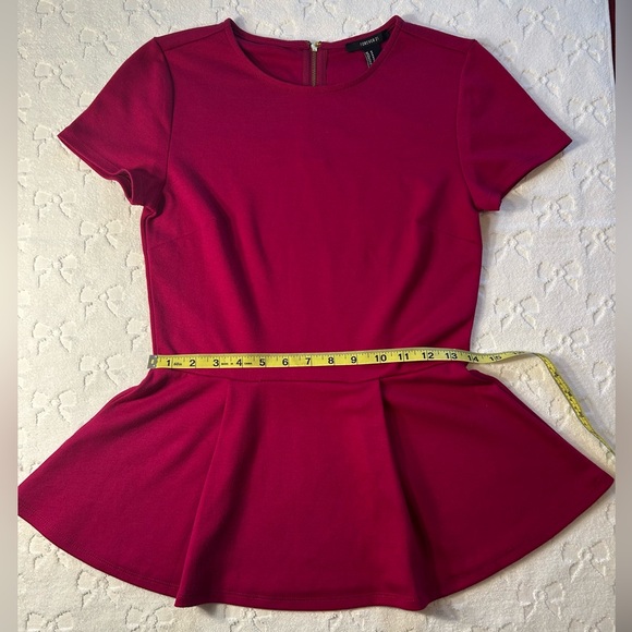 Rich magenta Forever 21 knit
Peplum top
Hardly worn EUC - Picture 3 of 3